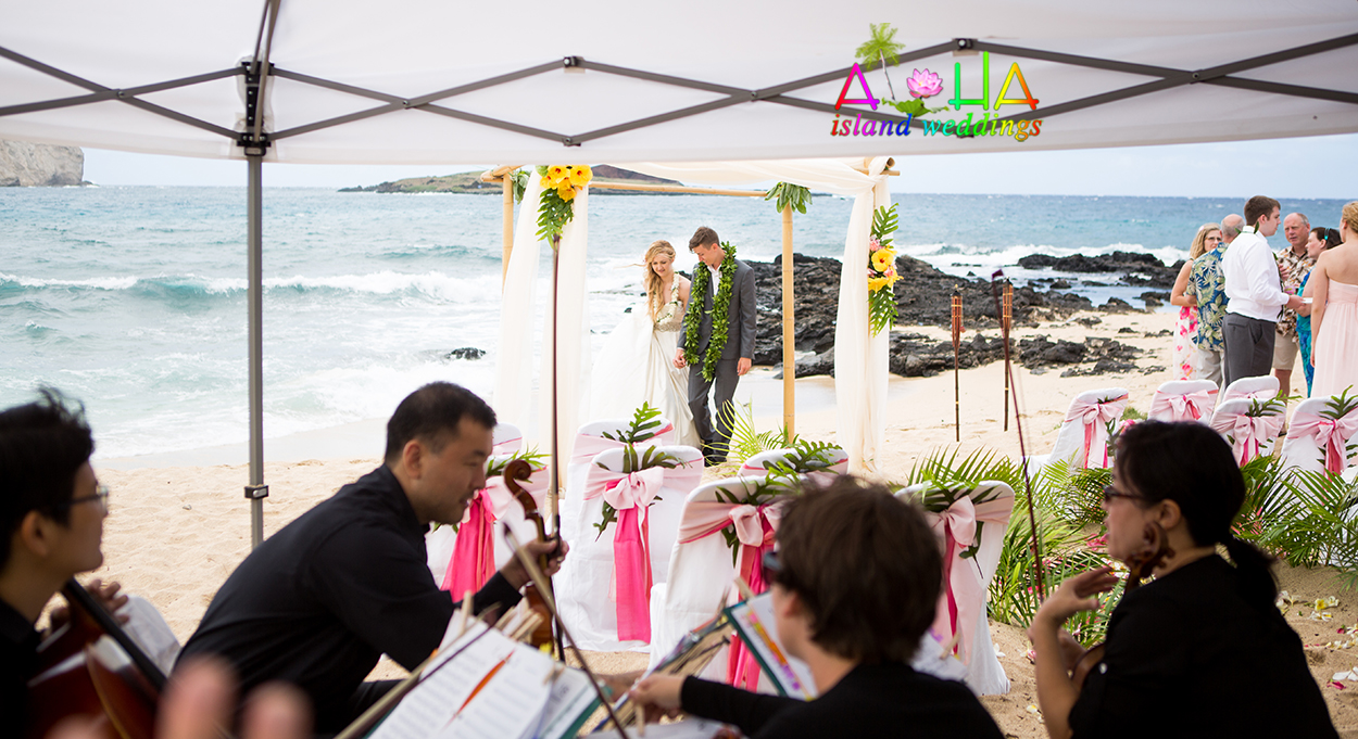 our Hawaii wedding music a quartet 2 violins a vialo and a cello played for me beach wedding ceremony in Hawaii